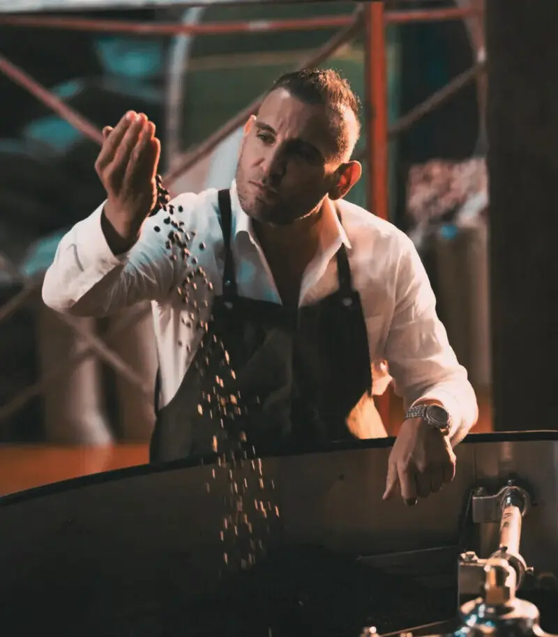 MRJADE Coffee barista checking freshly roasted coffee beans