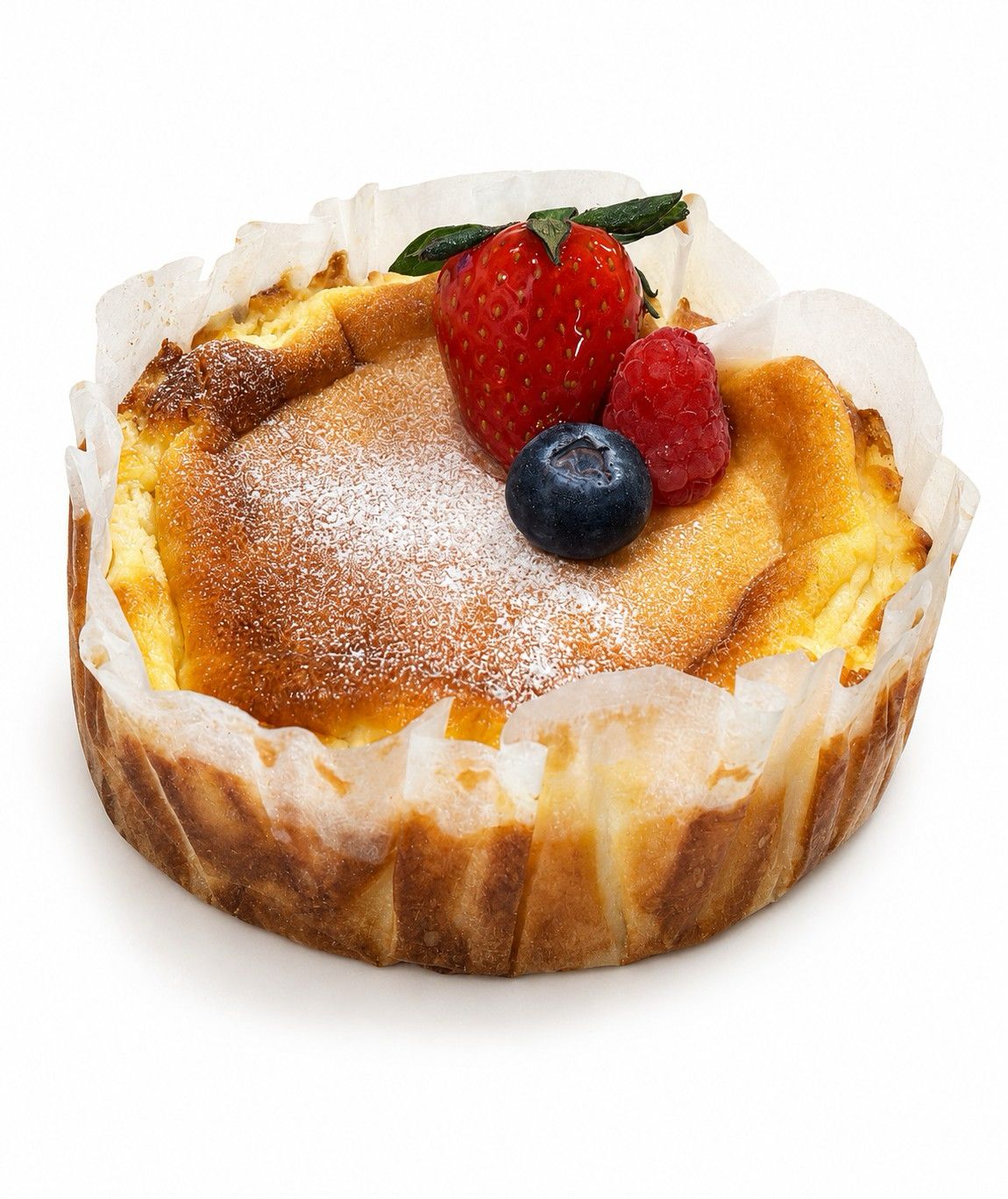 San Sebastian cheesecake topped with fresh berries at MRJADE Coffee